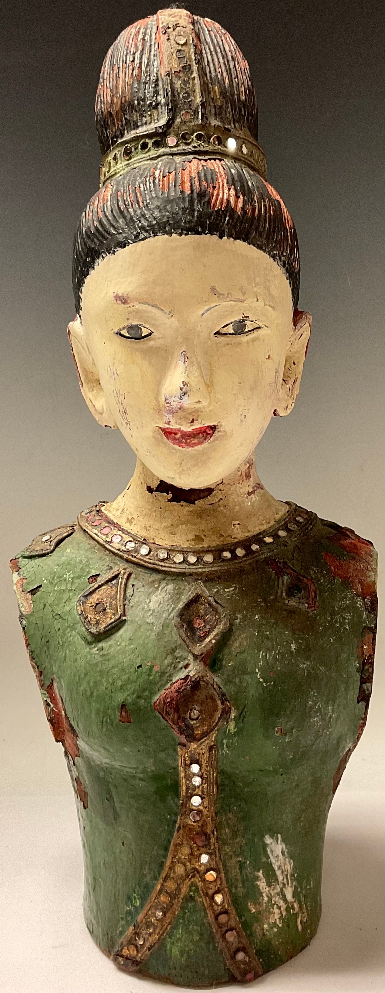 A painted carved wooden bust of an Asian lady, 42cm high