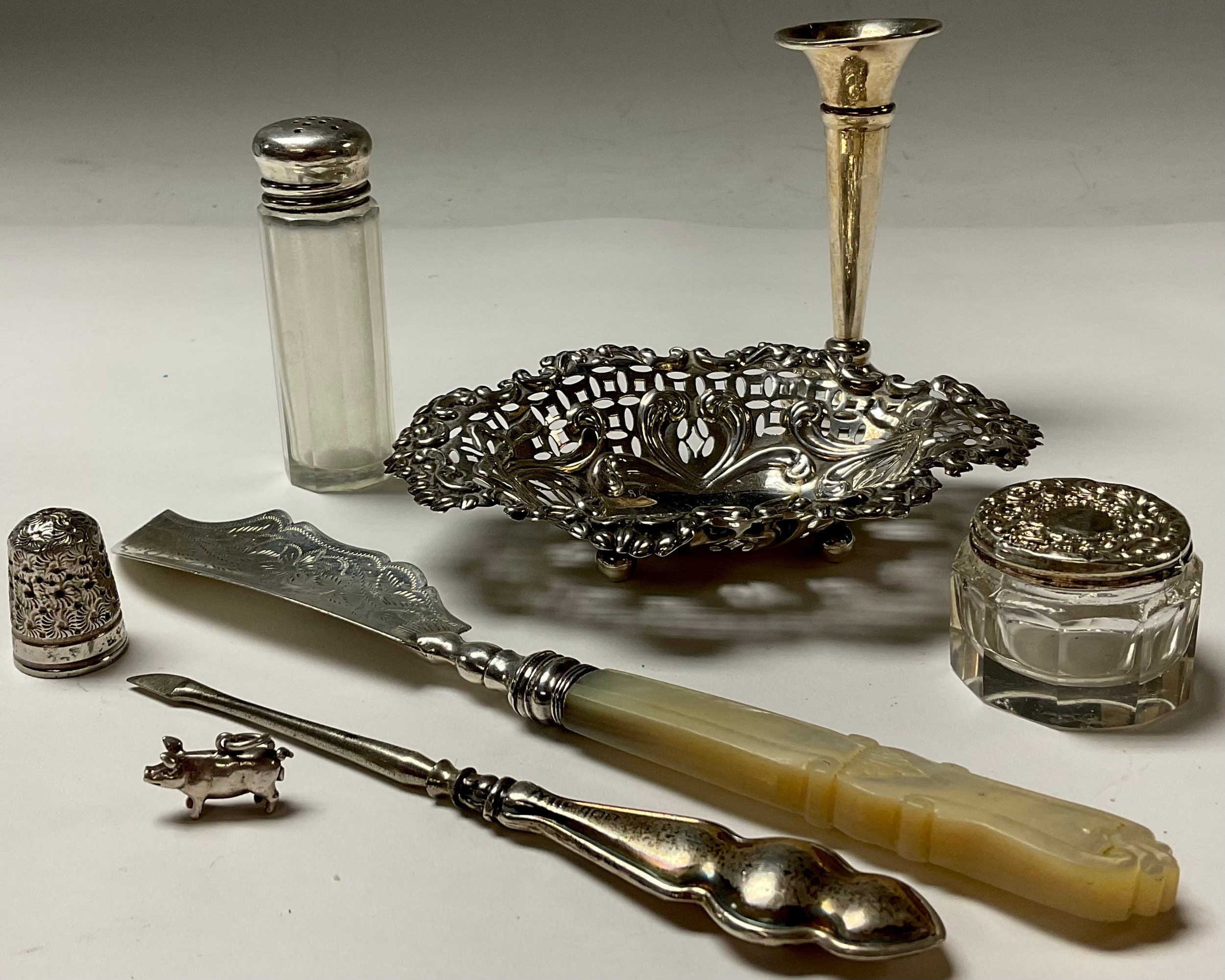 A Victorian silver and mother of pearl butter knife, Birmingham 1848; a silver sweetmeat dish;