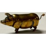 A Victorian novelty brass needlework tape measure, modelled as a pig