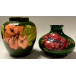 A Moorcroft Anemone pattern compressed ovoid bottle vase, 11cm; a Moorcroft Hibiscus pattern ovoid