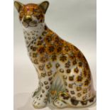 A Royal Crown Derby paperweight, Leopardess, gold stopper, printed mark, boxed