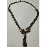 A Victorian Albertina and tassel, converted to a necklace, probably silver, unmarked