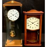 A Hermle wall clock, 59cm; a Rapport wall clock (2)