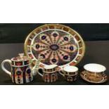 A Royal Crown Derby 1128 pattern miniature tea service, comprising teapot, cream jug, sugar bowl,