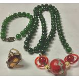 A jadeite and agate beaded necklace; a jadeite beaded bracelet; a 9ct gold smoky quartz ring, the