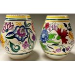 A pair of Poole ovoid vases, hand painted with large flower heads in colourful shades, 21cm, printed