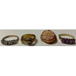 A 9ct gold four stone amethyst ring, R/S, 2.3g; a 9ct gold buckle ring, size N, 4.5g; a 9ct gold