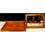 An early 20th century mahogany gallery tray, oval patera, 50cm long; a folding book rest (2)