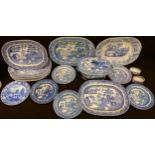 A set of five Victorian blue and white willow pattern serving platters; others similar, various