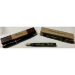 A Conway Stewart fountain pen, 14ct gold nib, boxed; a Parker pen, 14ct gold nib, boxed; another,