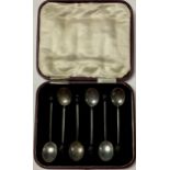 A set of six George V silver bean end coffee spoons, Sheffield 1928, cased