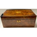 A late 19th/early 20th century burr walnut folding writing slope, brass inlaid, the central