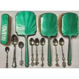 An emerald enamel dressing table set; a quantity of silver coloured metal teaspoons, some marked