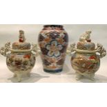 A pair of Japanese satsuma koros and covers, temple lion handles and finials, painted in