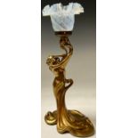 A French spelter Art Nouveau table lamp, cast as a female beauty in flowing sinuous gown, opaque