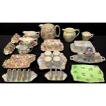 A Royal Winton Grimwades Marion pattern chintz egg stand, butter dish, five bar and three bar