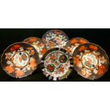 A composed set of four Royal Crown Derby 2444 Imari pattern dessert plates, 22cm diameter, early