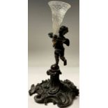 A 19th century bronze epergne, modelled as a putti holding cut glass trumpet vase, 21.5cm high
