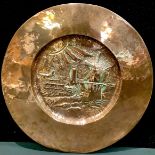 An Arts and Crafts copper charger, 54cm diameter