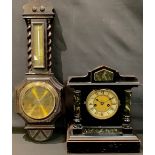 A late 19th century ebonised mantel clock, c.1870-1880; an oak wall mounted combination barometer (