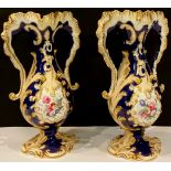 A pair of Rockingham type two handled baluster vases, the central catouches painted with