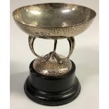 An Art Nouveau planished silver circular pedestal dish, on turned wooden stand, the pedestal as