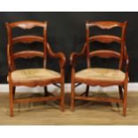 A pair of large provincial design ladderback elbow chairs, rush seats, 107cm high, 69cm wide, the