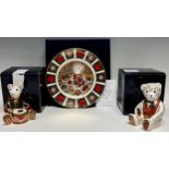 A Royal Crown Derby paperweight, Drummer Teddy, gold stopper, boxed; another, Blue Bow Tie Teddy,