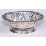 A Victorian silver shaped oval sweetmeat basket, pierced and embossed with flowers, stiff leaves and