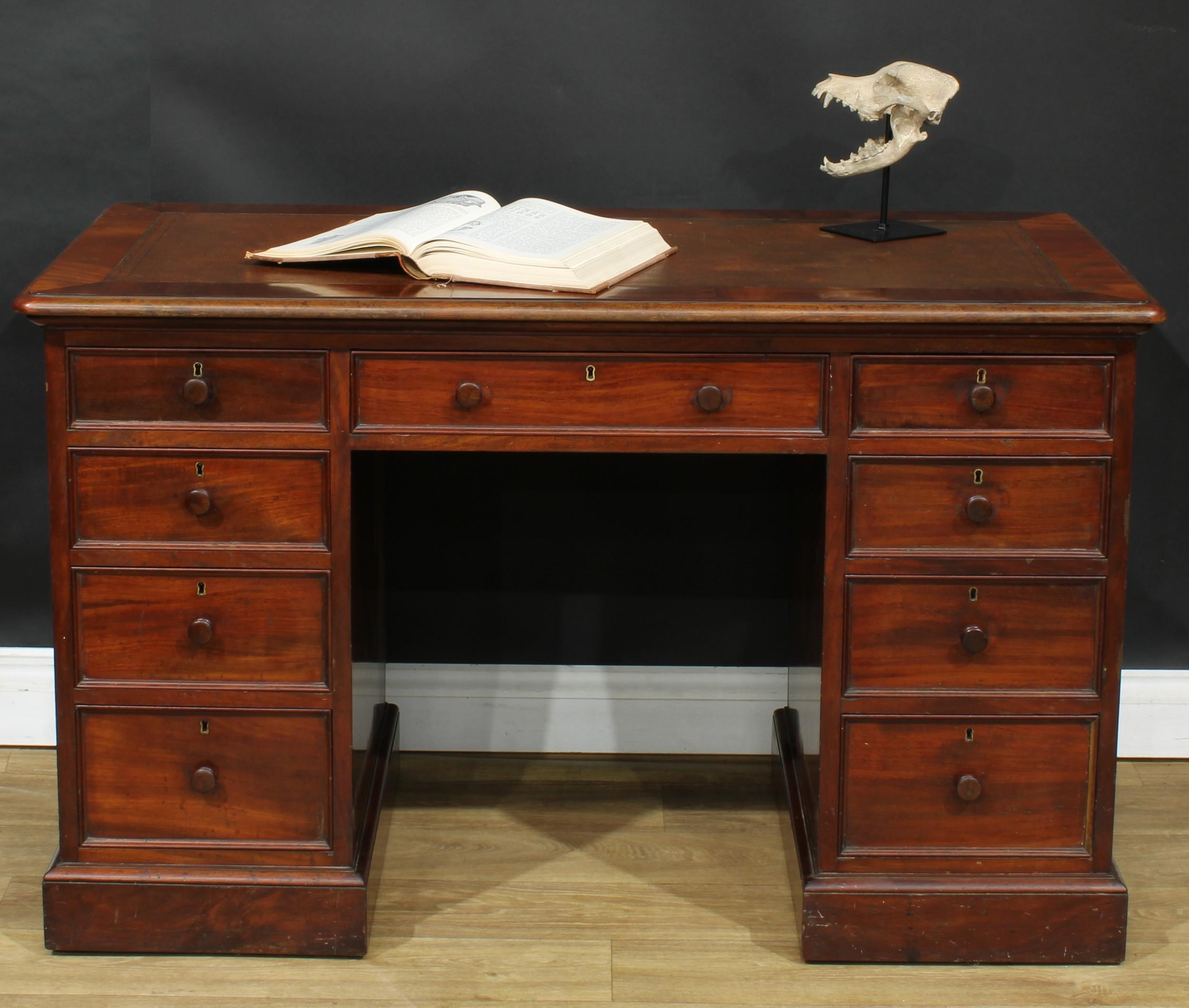 An early Victorian mahogany partners’ desk, by Miles & Edwards, 134 Oxford Street, London, stamped