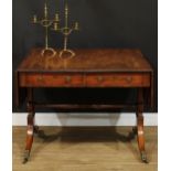 A Regency mahogany sofa table, rounded rectangular top with reeded edge and fall leaves above a pair