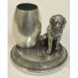 A late Victorian/Edwardian silver plated novelty table vesta, as a dog seated beside a barrel, match