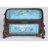 A 19th century French enamel rounded rectangular casket, decorated with flowers on a pale blue