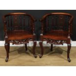 A pair of Chinese hardwood armchairs, horseshoe arm rails above pierced splats and turned
