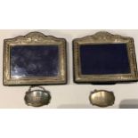 A pair of silver photograph frames, Sheffield 2003/2005; a pair of silver decanter labels, Brandy