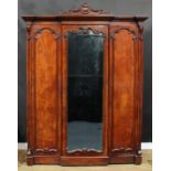 A Victorian mahogany breakfront wardrobe, by A. Blain, Liverpool, stamped, outswept cornice with