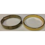 A silver bangle, Birmingham 1963; an 18ct gold plated bangle (2)