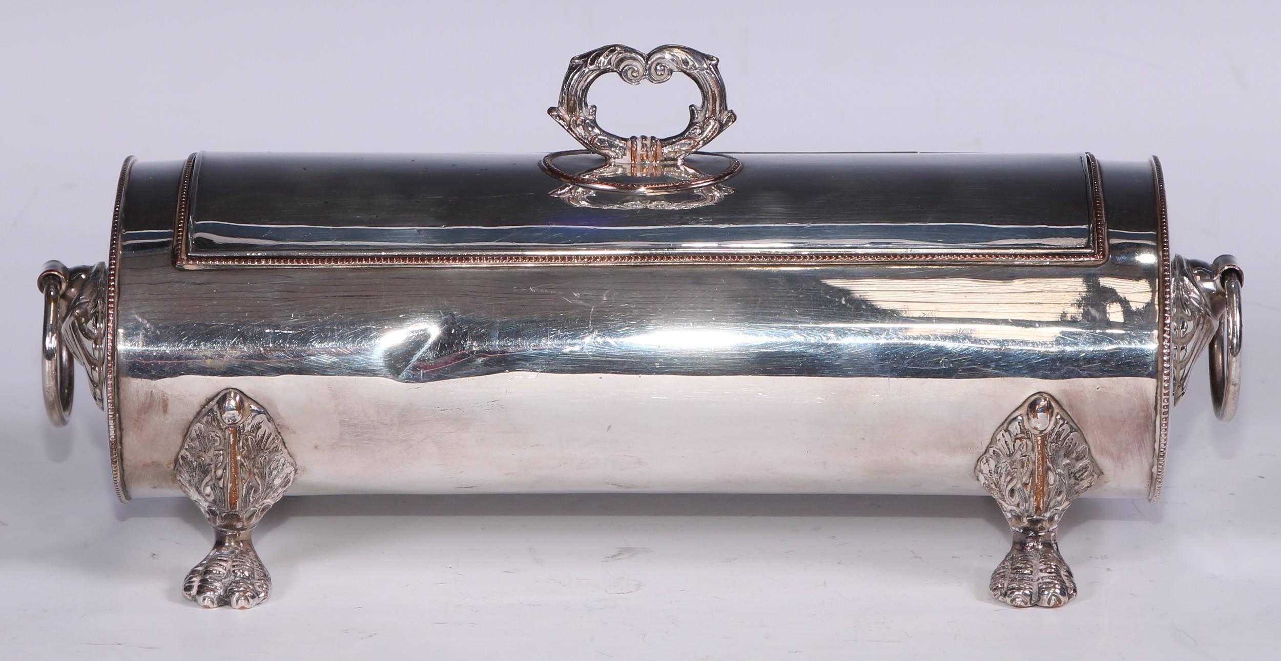 A Regency Old Sheffield Plate oval treasury inkstand, hinged cover with leafy-loop handle