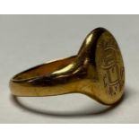 A George V 18ct gold signet ring, monogrammed SH, size R, Birmingham 1918, 6.98g