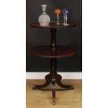 A Regency mahogany two-tier dumbwaiter, circular plateaux, turned pillar, reeded sabre legs, brass