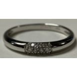 An 18ct white gold ring, pave set with diamonds, size P, 2.3g