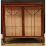 A mahogany display cabinet, cabriole legs, ball and claw feet, 125cm high, 120.5cm wide, 30.5cm deep