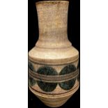 A Troika bottle vase, decorated by Leslie King, monogrammed, painted with a divided band of circles,