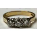 A 9ct gold three stone diamond ring, marked 375, size K, 2g