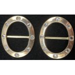 A pair of Victorian oval diamond and gold coloured metal buckles, quite plain, set with eight evenly