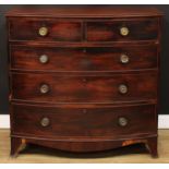 A Regency mahogany bow front chest, slightly oversailing top with channelled edge above two short