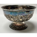 A Victorian silver pedestal bowl, stop fluted, embossed with foliate scrolls, 16cm diameter, 10cm