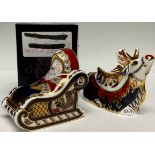 A Royal Crown Derby paperweight, Santa and Sleigh, gold stopper, associated box; another,
