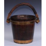 An early 20th century coopered oak fireside fuel or peat bucket, leather covered rope handle, 30.5cm