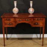 A Sheraton Revival satinwood crossbanded mahogany serpentine serving table, slightly oversailing top